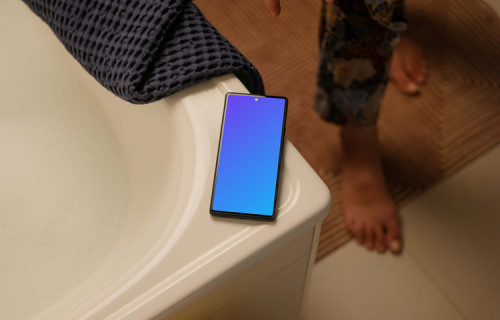 Person standing next to Google Pixel mockup