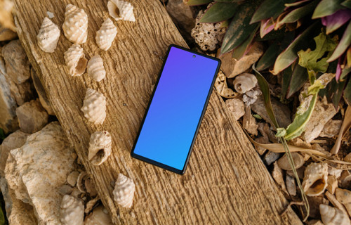 Pixel 6 mockup on a beach beside some seashells