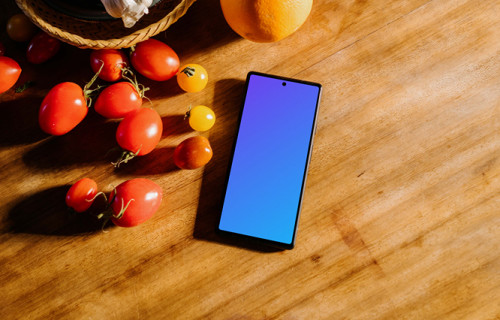 Pixel 6 mockup on a table next to fruits