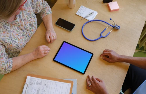 Tablet mockup between doctor and the patient