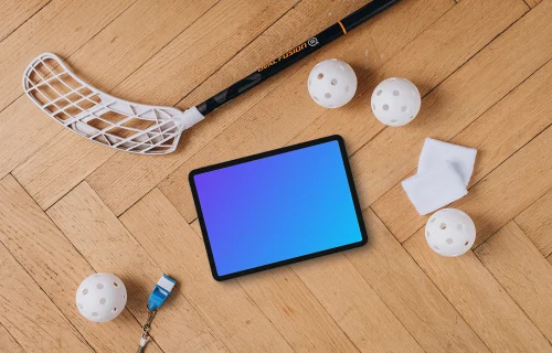 Tablet mockup next to the floorball stick