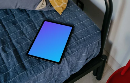 Tablet mockup placed on a bed