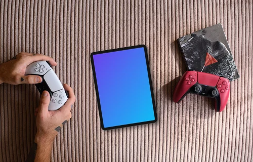 Tablet mockup with gaming controllers on textured background