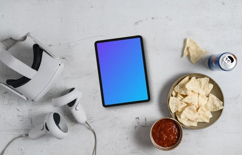 Tablet mockup with VR gaming setup and snacks