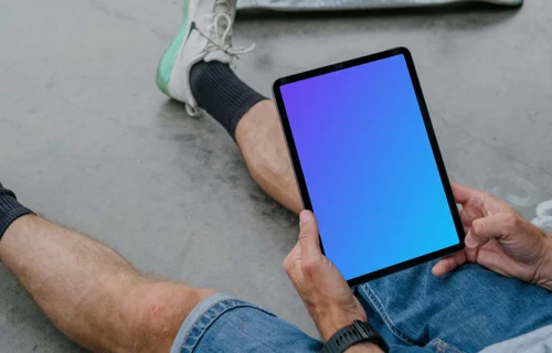 User holding a tablet mockup