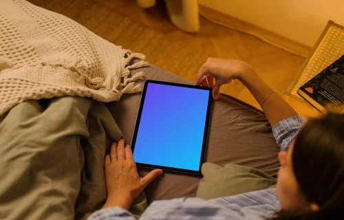 User holding an iPad Air mockup