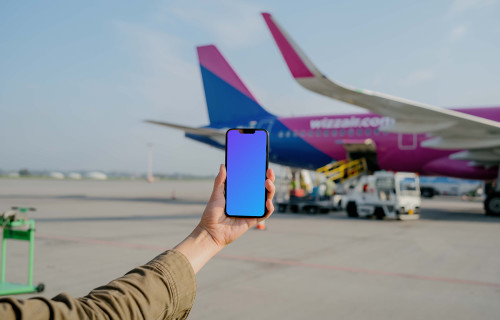 User holding an iPhone mockup