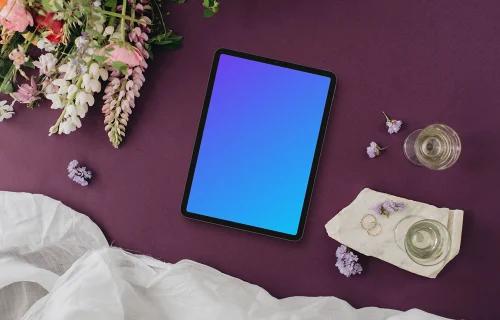 Wedding bliss with iPad mockup, rings, and flowers