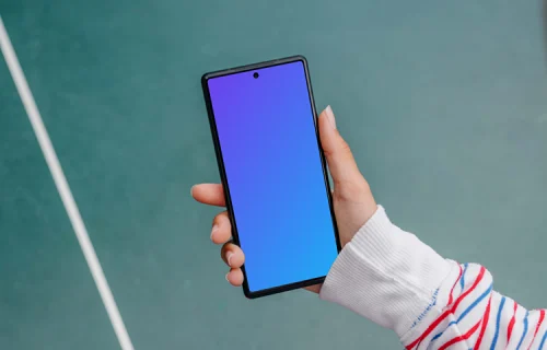 Woman hand holding a phone mockup while playing ping-pong