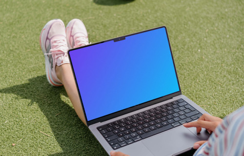 Woman hand scrolling on a MacBook Pro 14 mockup