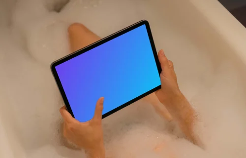 Woman hand typing on an iPad Air mockup