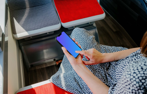 Woman hand typing on an iPhone 13 mockup