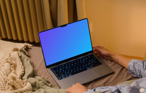 Woman holding a MacBook Pro 14 mockup