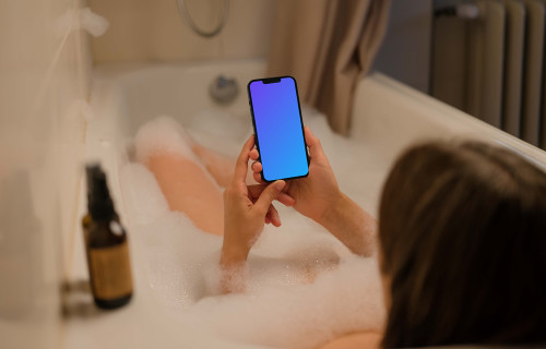 Woman holding a phone mockup