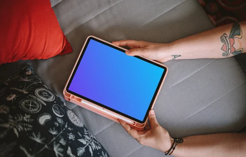 Woman holding an iPad Air mockup