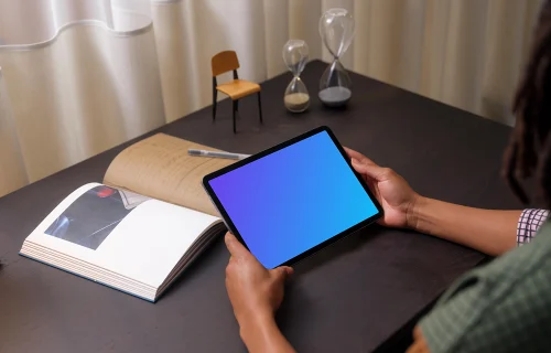 Woman holding an iPad Air mockup