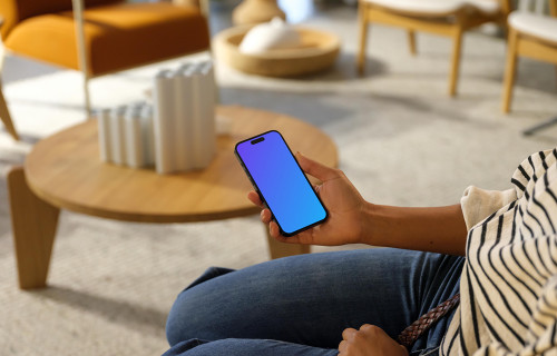 Woman holding an iPhone 14 Pro mockup