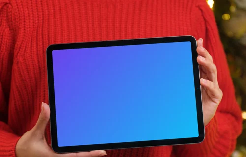 Woman in red sweater holding tablet mockup