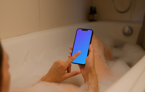 Woman pointing at an iPhone 13 mockup