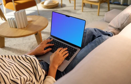 Woman typing on a MacBook Pro 14 mockup