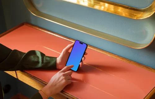 Woman typing on a phone in the lounge