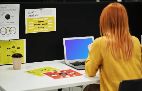 Woman using a MacBook Air mockup