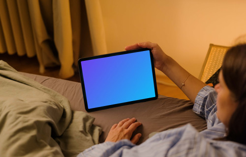 Woman watching on an iPad Air mockup
