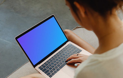 Woman working on a MacBook Air mockup