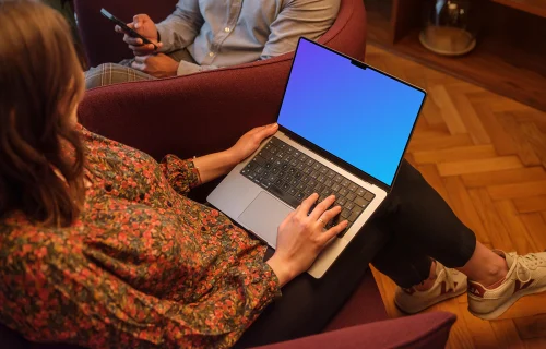 Woman working on a MacBook Pro 14 mockup in the office