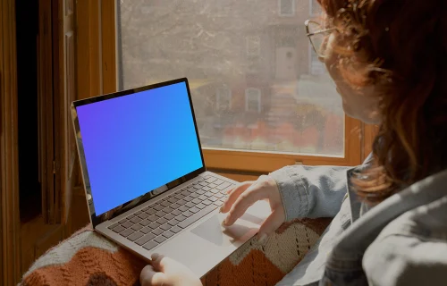 Woman working on laptop mockup
