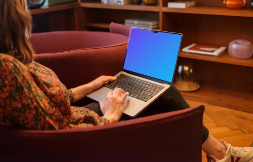 Woman working on the MacBook Pro mockup in office environment