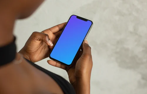 Young lady holding an iPhone 12 mockup