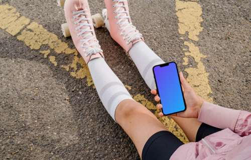 Young woman holding a phone mockup
