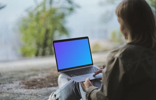 Young woman reading on MacBook Air mockup