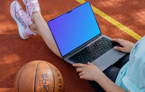 Young woman working on a MacBook Pro mockup