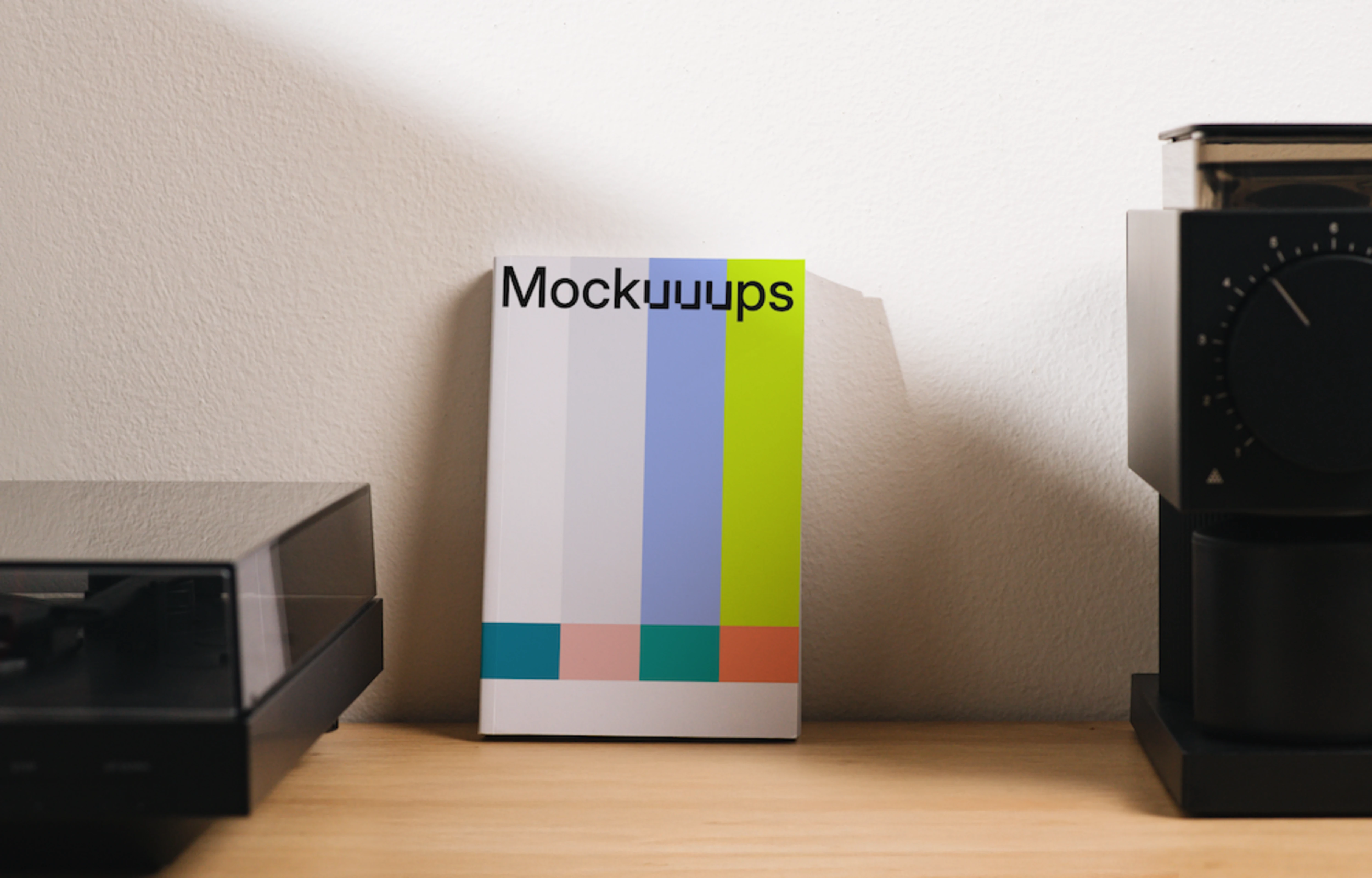 Book mockup on a modern wood desk