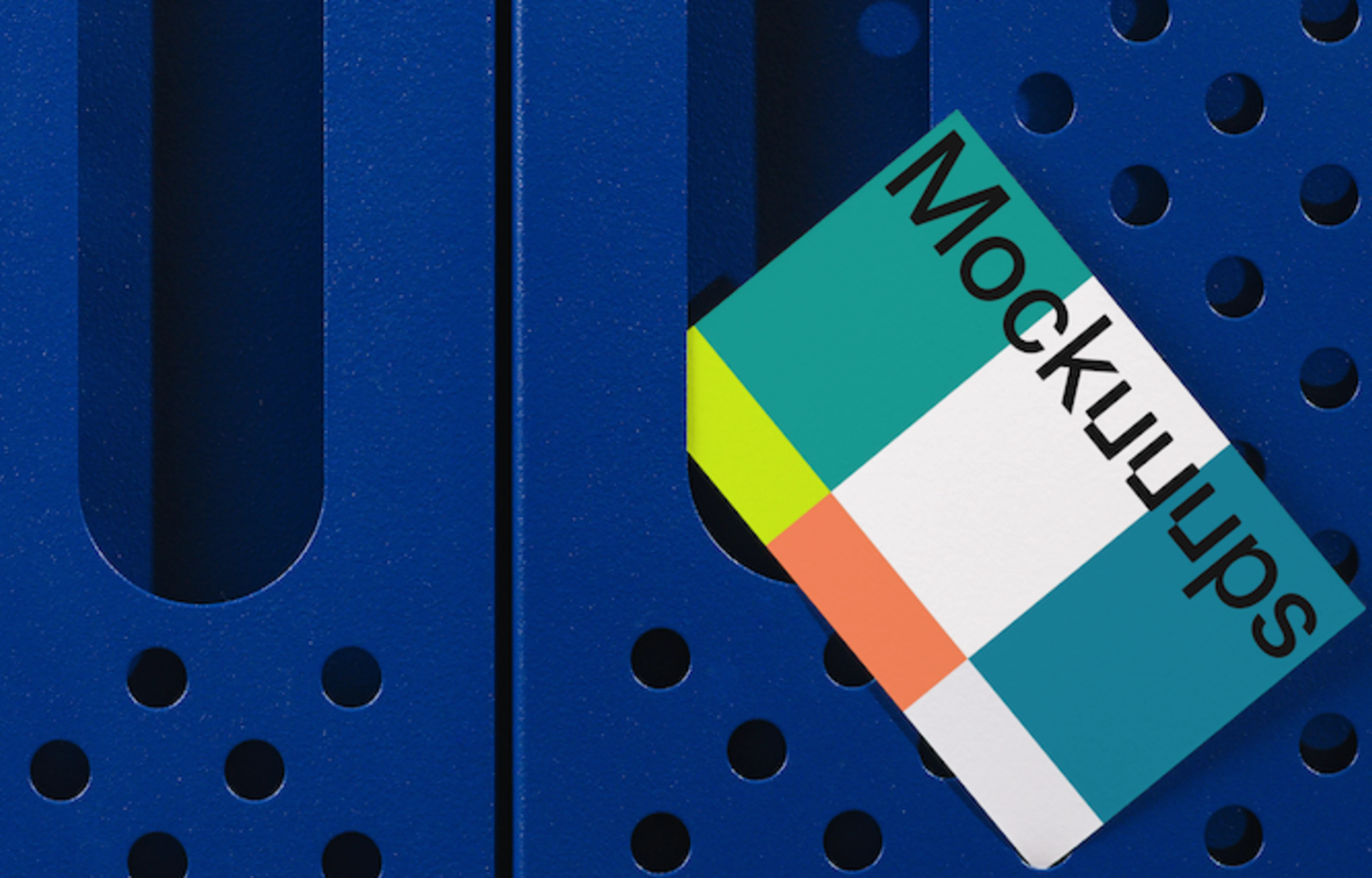 Business card mockup against blue perforated surface