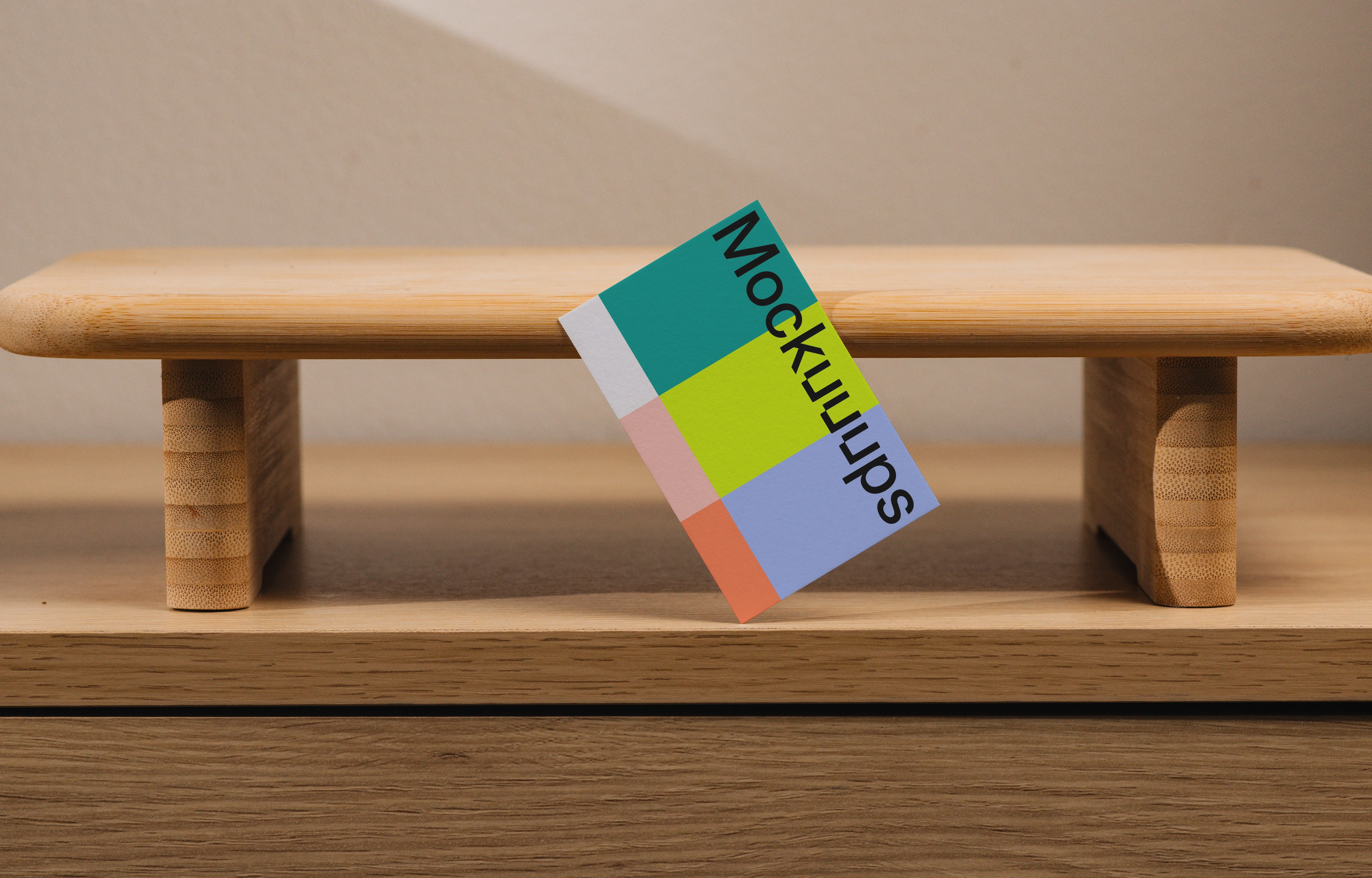 EU business card mockup on a wooden desktop stand