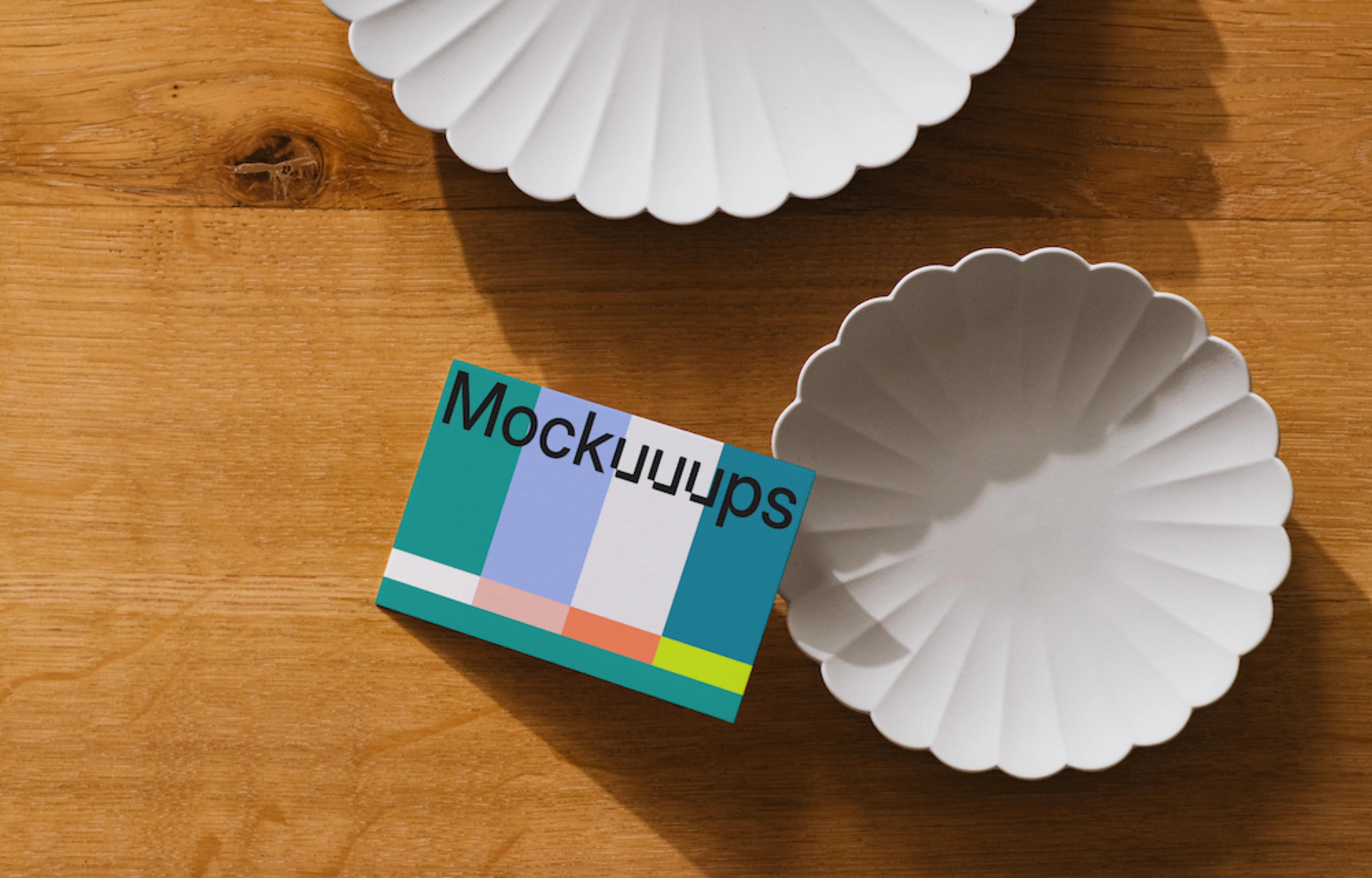 EU business card mockup on a wooden surface with dishes