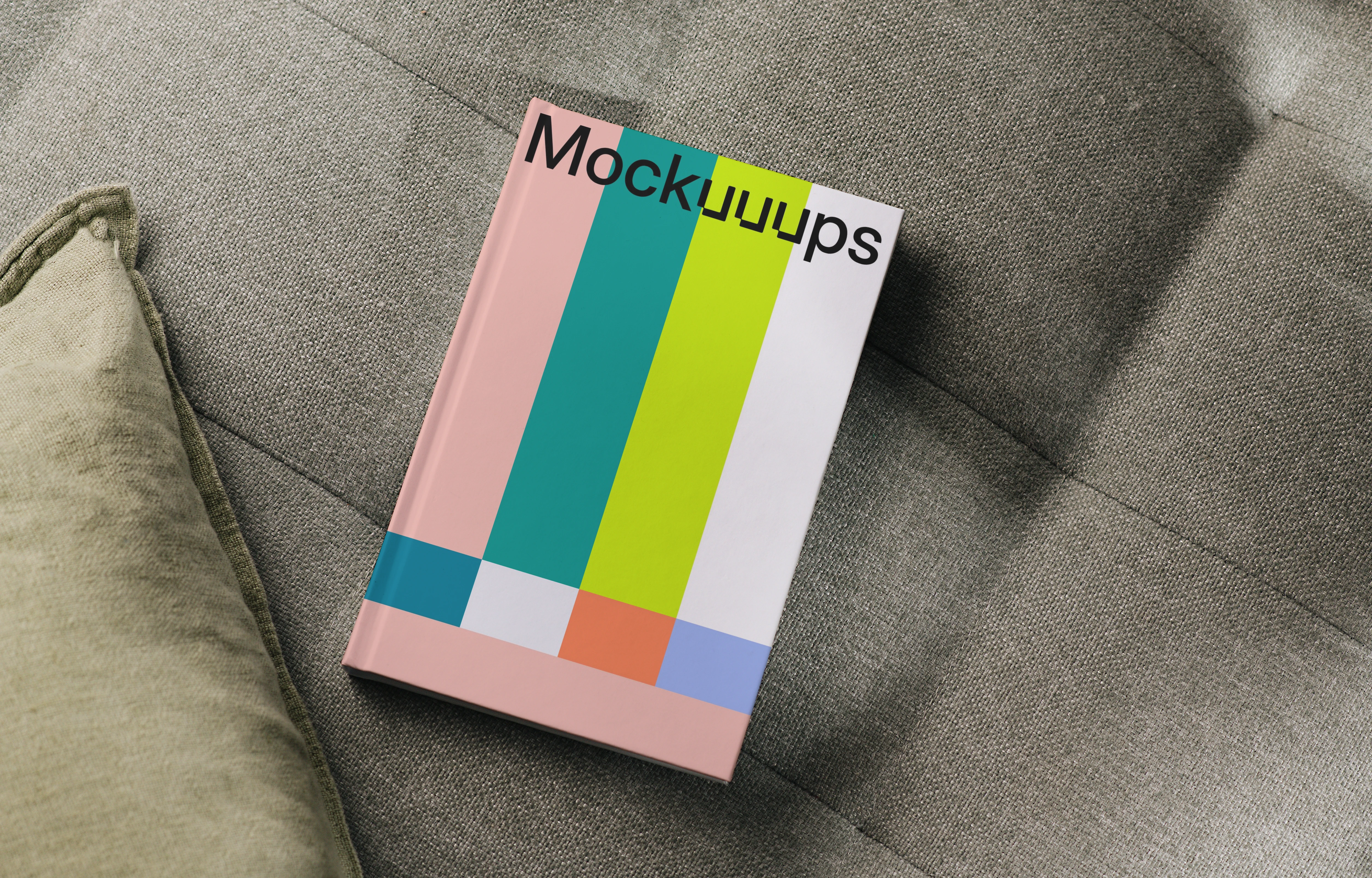 Hardcover book mockup on a textured sofa