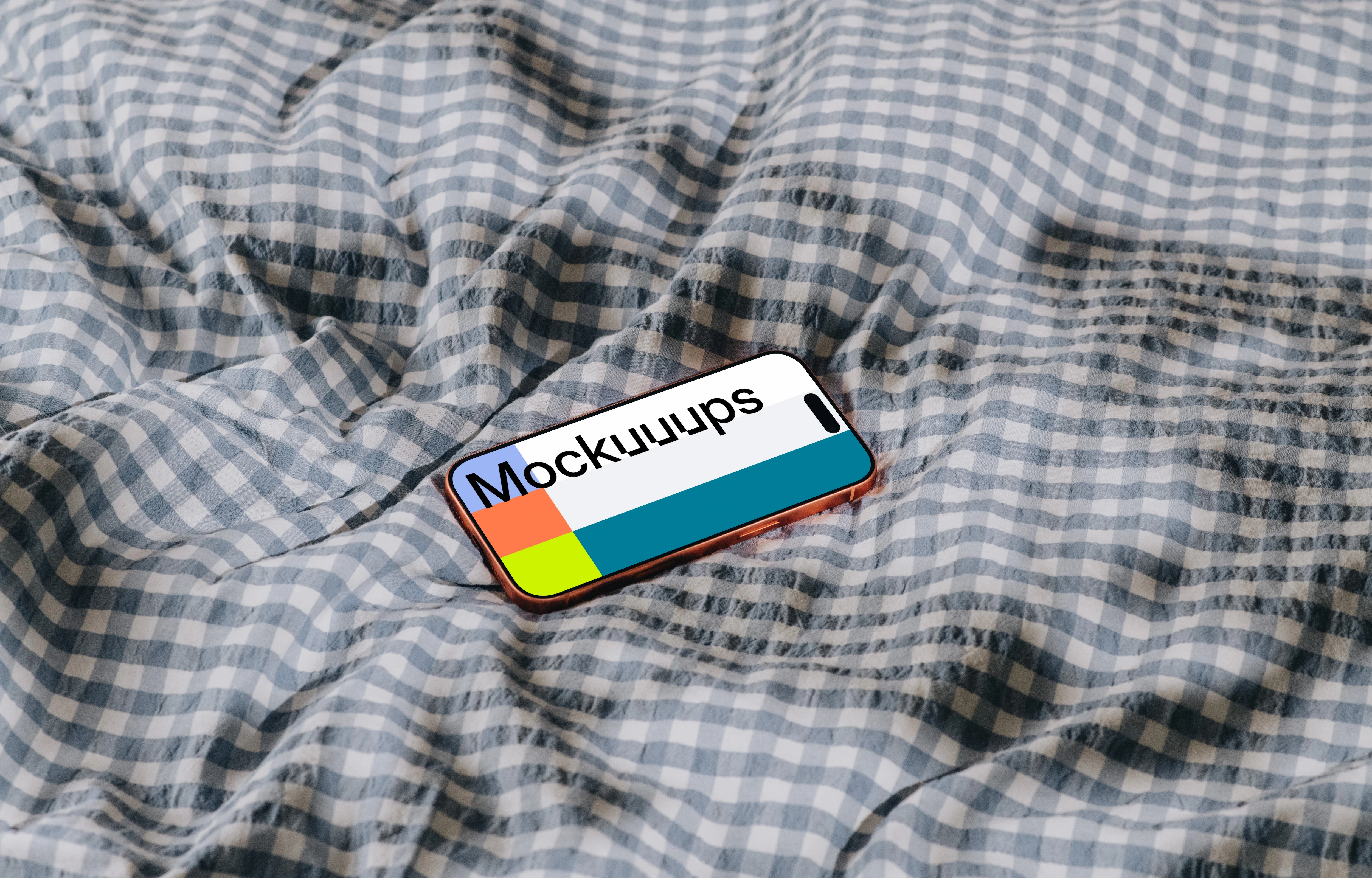 iPhone 17 Pro mockup on a checkered fabric surface