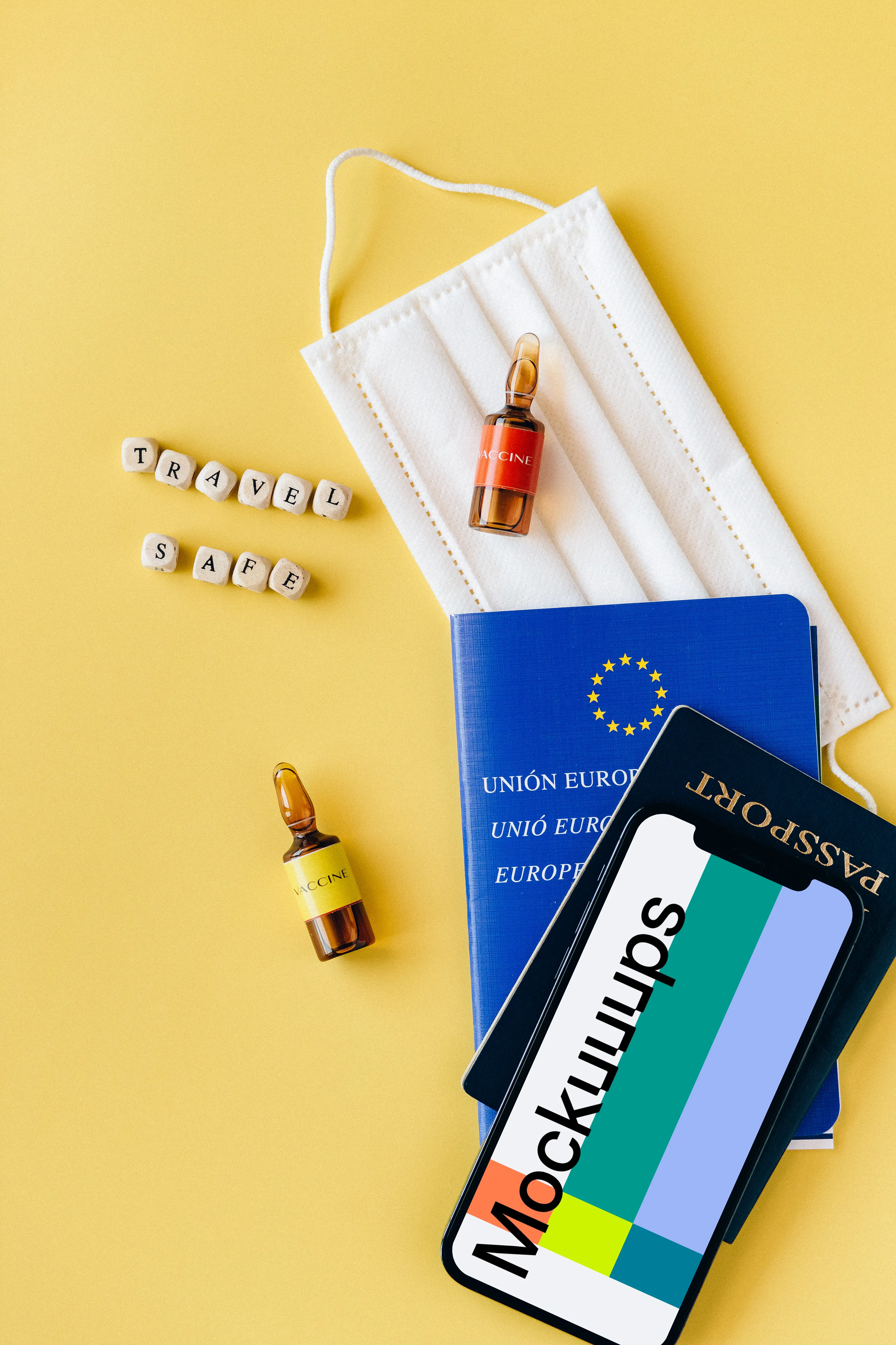 iPhone 12 Pro mockup on a passport beside a vial of vaccine