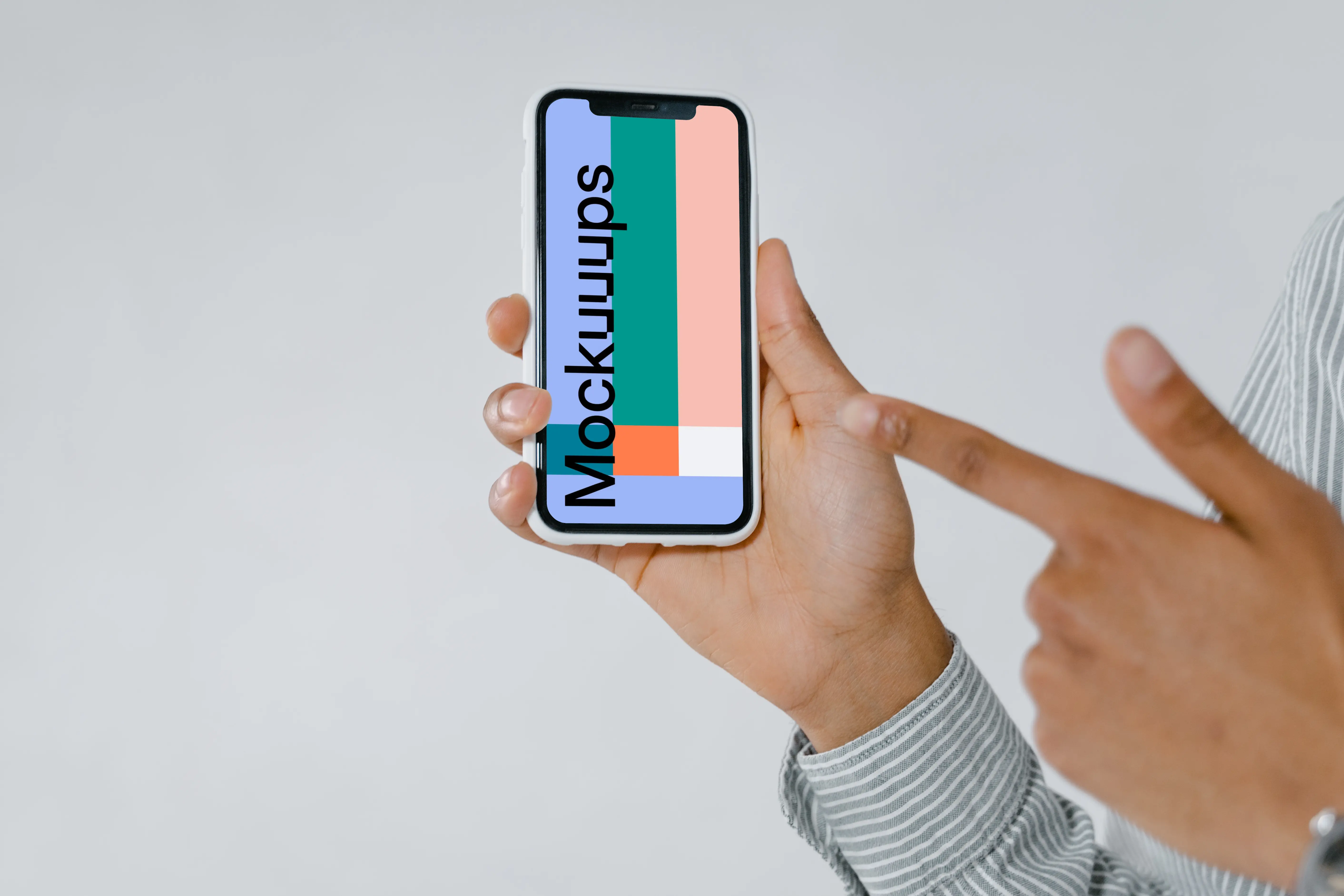 iPhone mockup of user pointing at screen