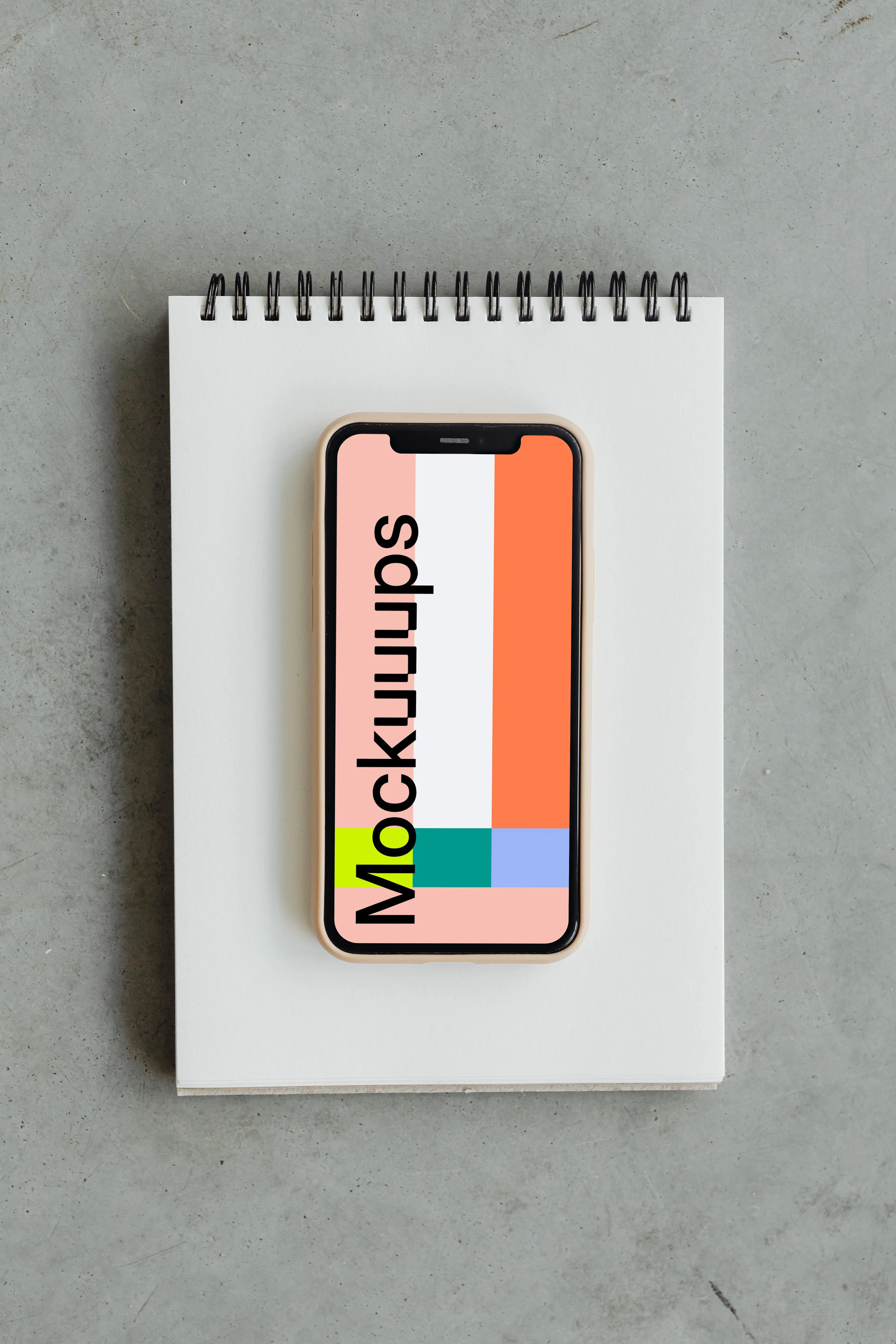 Minimal iPhone mockup on a jotter
