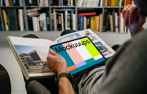 iPad Air mockup in a user’s hand in a library