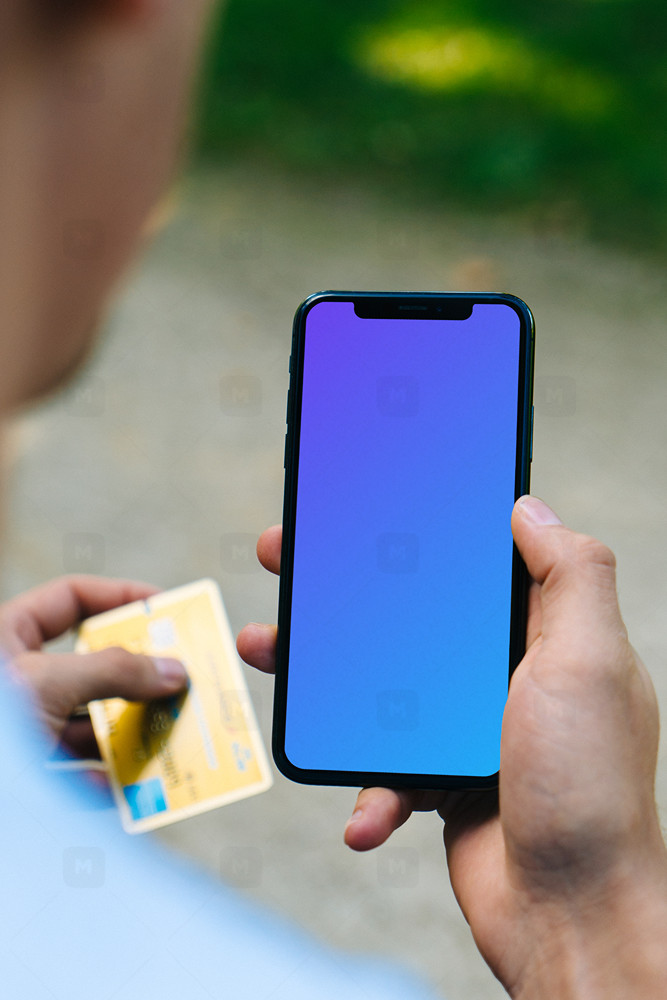 Holding iPhone mockup and credit card