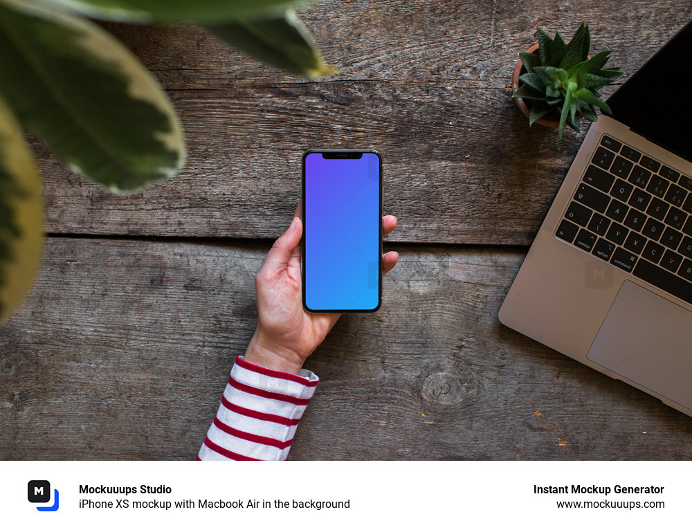 iPhone XS mockup with Macbook Air in the background