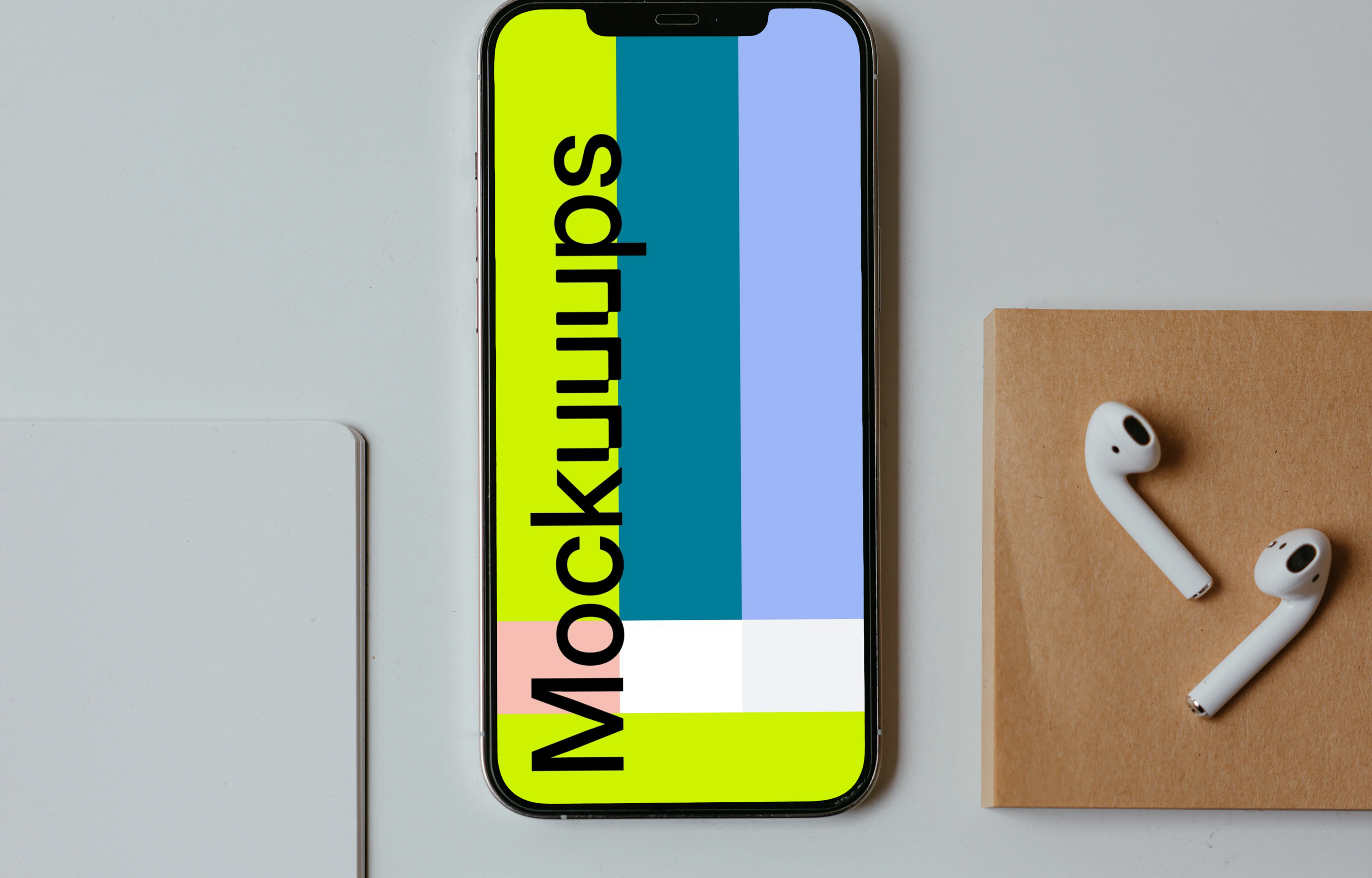 Minimal iPhone mockup on a white table