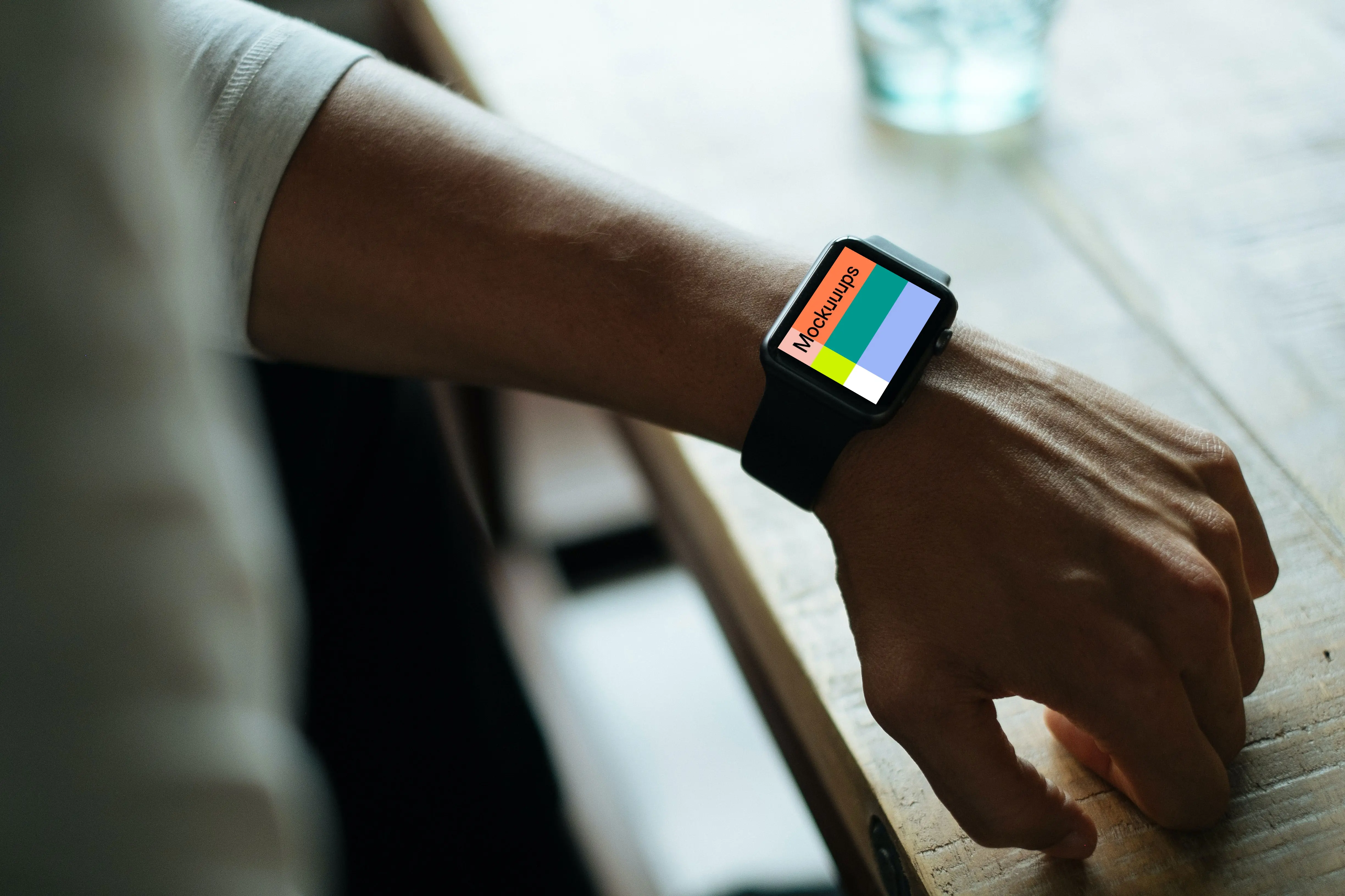 Apple Watch mockup beside glass desk