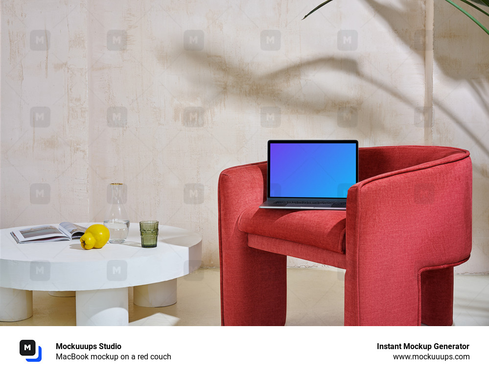 MacBook mockup on a red couch